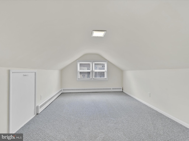 bonus room featuring vaulted ceiling, carpet floors, and baseboards