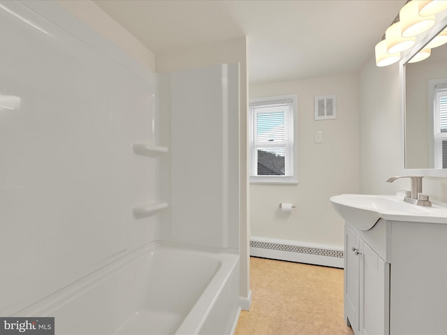 full bath with a wealth of natural light, a baseboard radiator, visible vents, and vanity