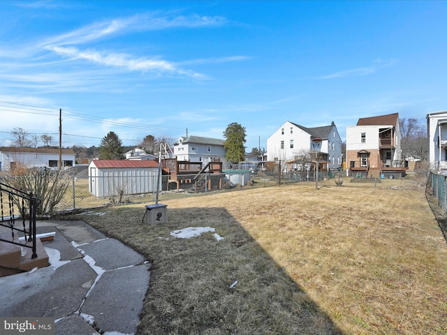 view of yard with a residential view and fence