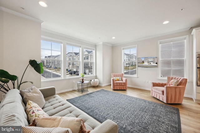 living area featuring crown molding, recessed lighting, baseboards, and light wood-style floors