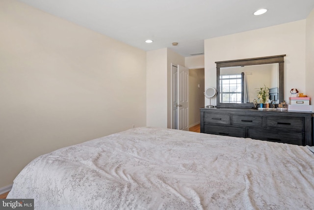 bedroom featuring recessed lighting