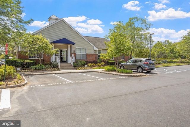 view of property featuring uncovered parking