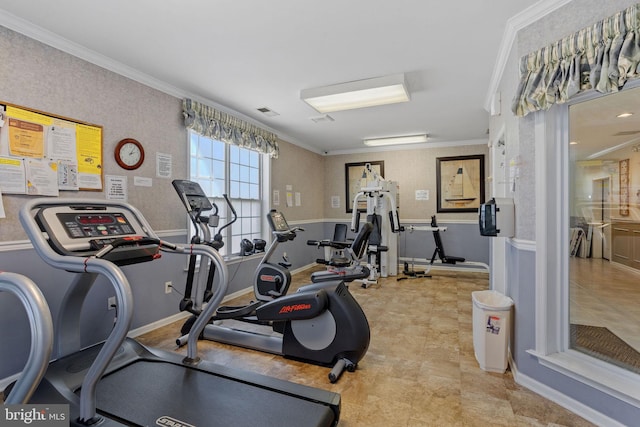 workout area featuring visible vents and crown molding