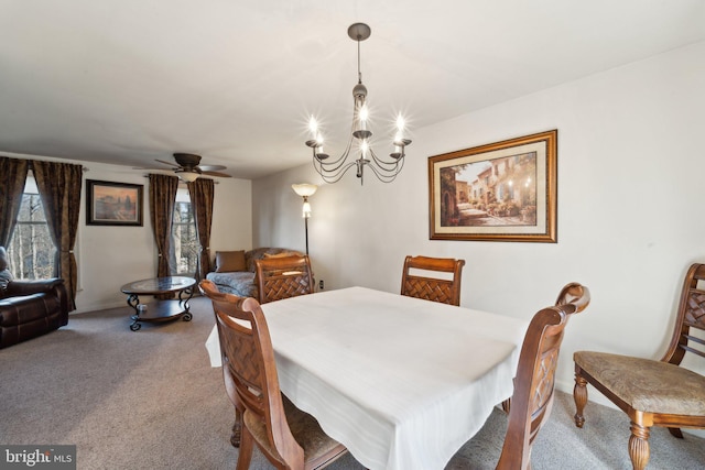 39375 Thomas Dr, Mechanicsville, MD 20659 - carpeted dining room with ceiling fan with notable chandelier and baseboards