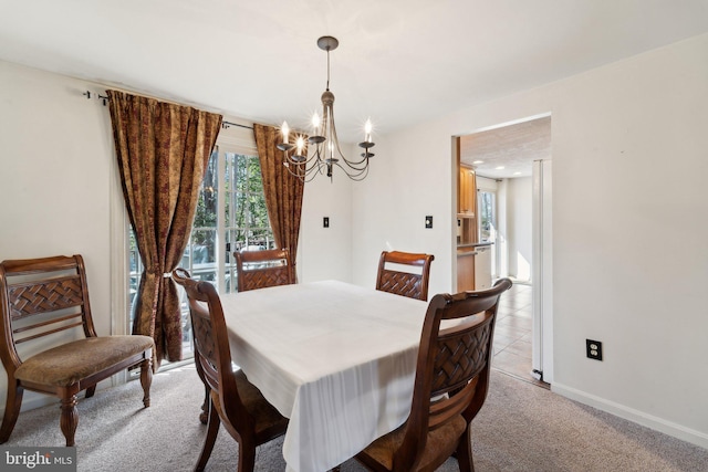 39375 Thomas Dr, Mechanicsville, MD 20659 - dining room featuring an inviting chandelier, light colored carpet, and baseboards