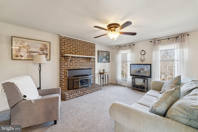 carpeted living area featuring ceiling fan