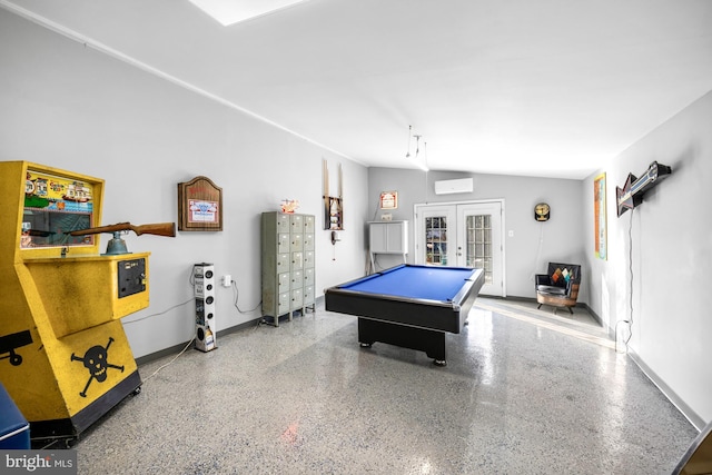 playroom featuring french doors, pool table, a wall mounted air conditioner, vaulted ceiling, and speckled floor