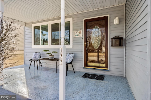 doorway to property featuring a porch