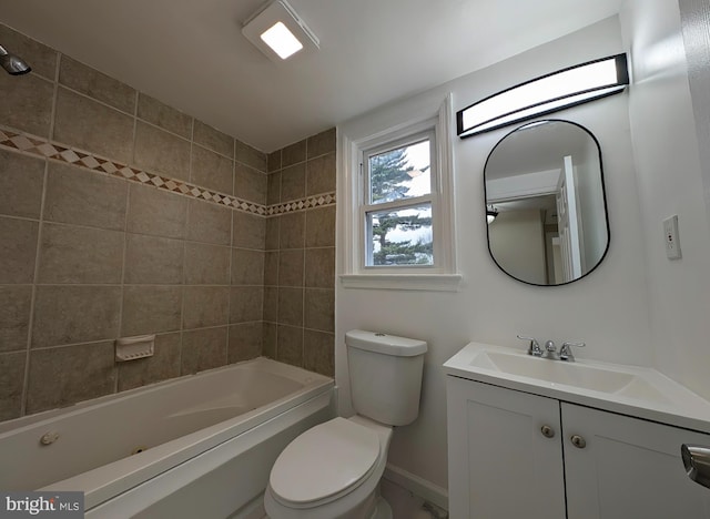 full bathroom with  shower combination, baseboards, vanity, and toilet