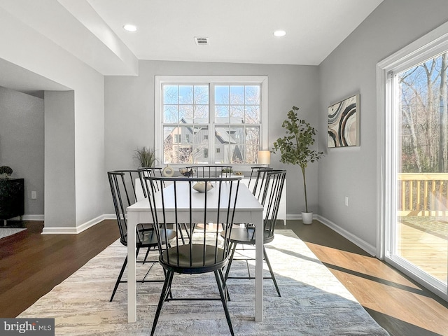 dining room featuring recessed lighting, visible vents, baseboards, and wood finished floors