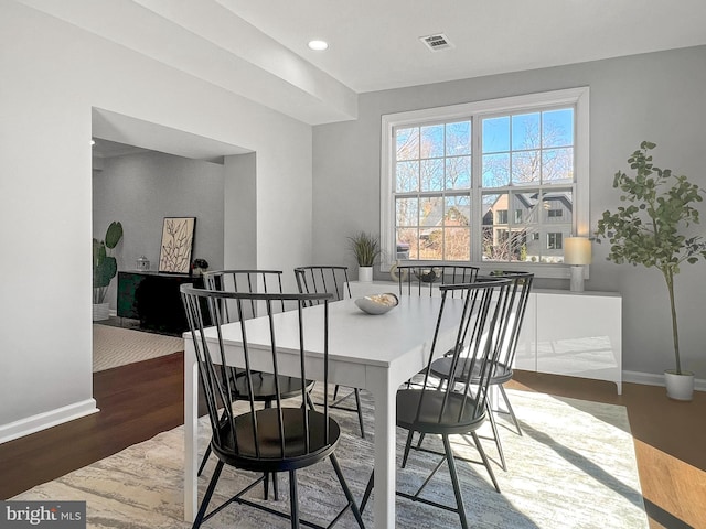 dining room featuring recessed lighting, visible vents, baseboards, and wood finished floors