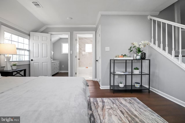 bedroom featuring baseboards, visible vents, lofted ceiling, wood finished floors, and crown molding