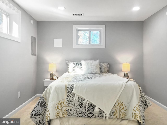 carpeted bedroom with recessed lighting, visible vents, and baseboards