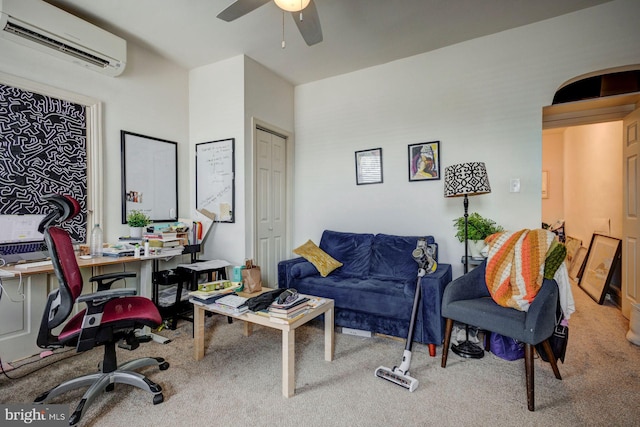 carpeted office with a ceiling fan and a wall unit AC