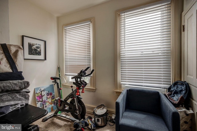 workout room with baseboards