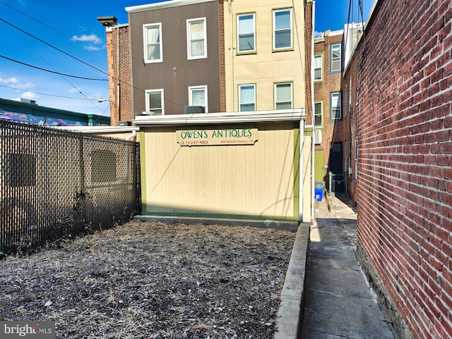 view of gate with fence