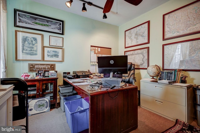 carpeted office space with rail lighting and ceiling fan