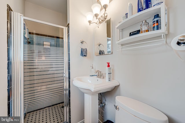 bathroom with a shower stall and toilet