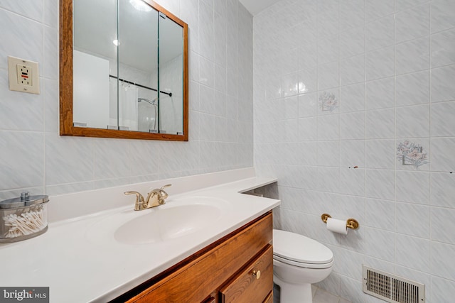 full bath featuring visible vents, toilet, tile walls, and vanity