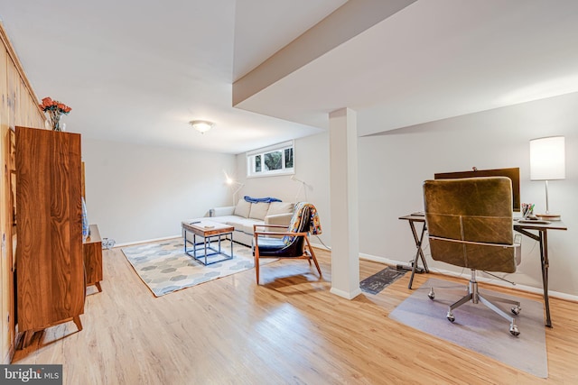 interior space with light wood-style flooring and baseboards