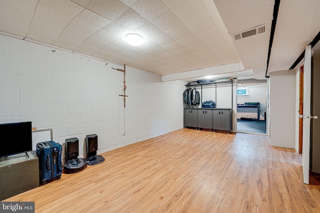 interior space with wood finished floors and visible vents