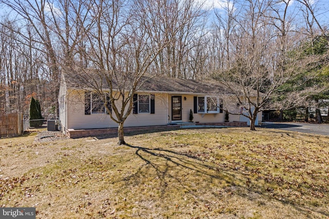 single story home featuring central AC, a front yard, fence, and driveway