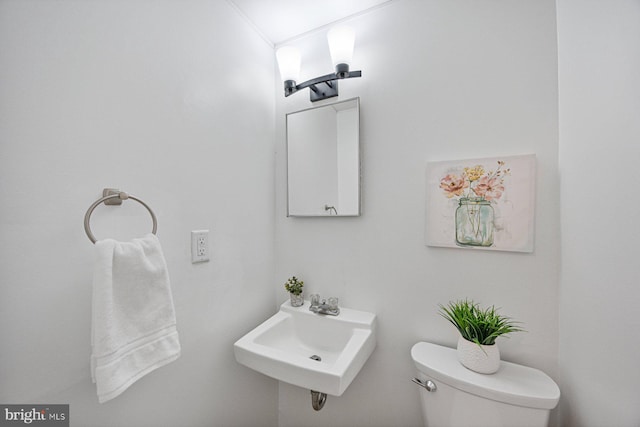 bathroom featuring a sink and toilet