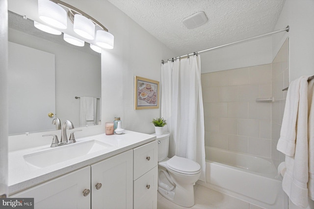 full bathroom with shower / tub combo, toilet, tile patterned flooring, a textured ceiling, and vanity