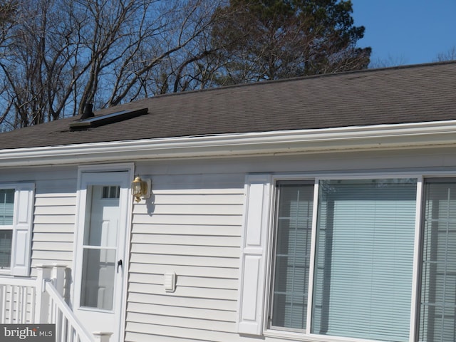 details with gutters and roof with shingles