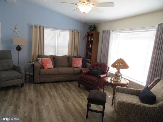 living room featuring lofted ceiling, a ceiling fan, a wealth of natural light, and wood finished floors