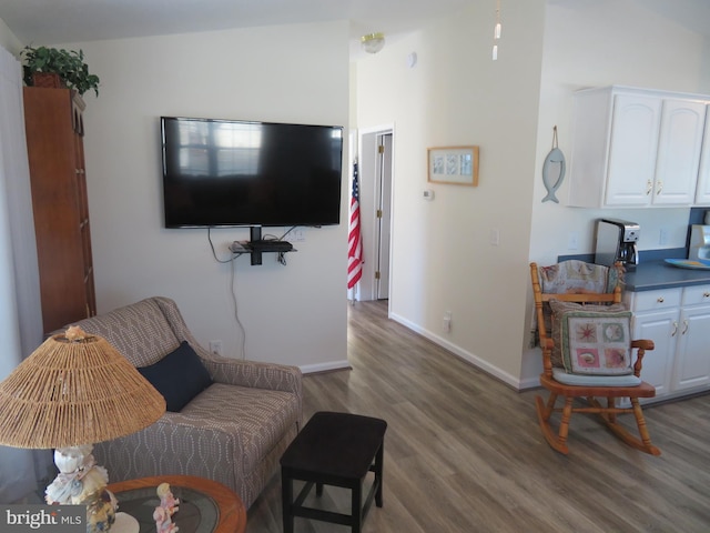 living room with wood finished floors and baseboards