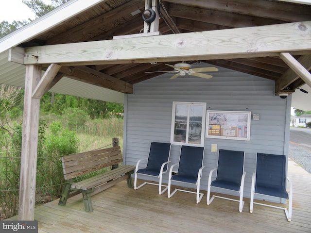 wooden terrace featuring a ceiling fan