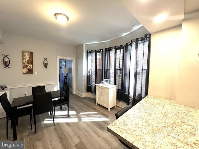 interior space with light wood-style floors and baseboards