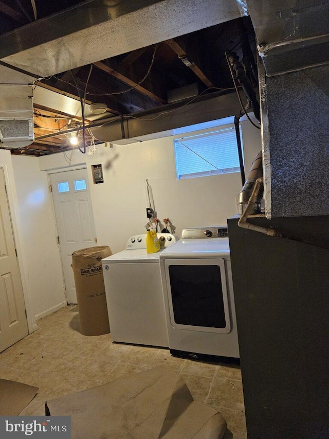 laundry room with washer and dryer and laundry area