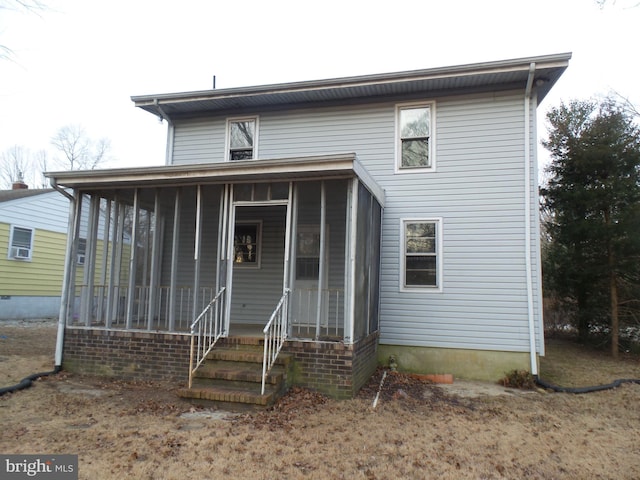 view of front of house featuring a sunroom