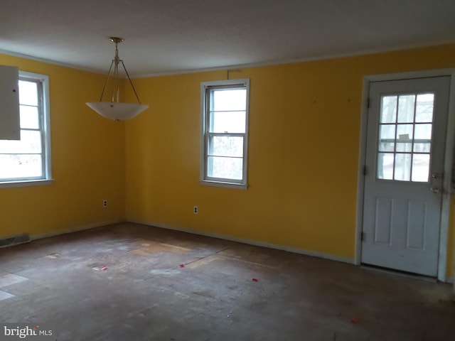 unfurnished dining area featuring a healthy amount of sunlight and visible vents