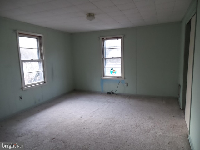 empty room with light colored carpet