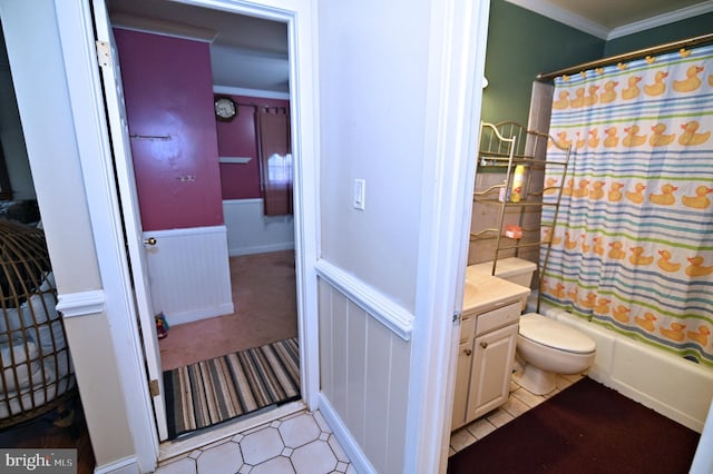 bathroom with toilet, a wainscoted wall, vanity, ornamental molding, and shower / bath combo with shower curtain