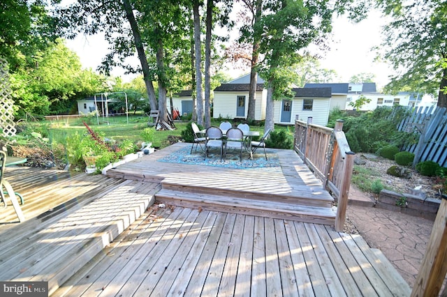 wooden deck featuring outdoor dining space