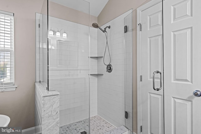 full bathroom with a shower stall