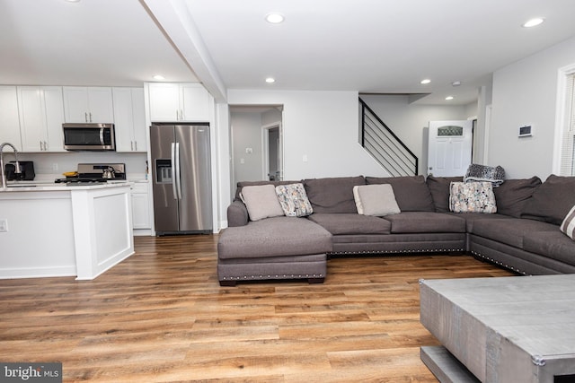 916 Phillip Powers Dr, Laurel, MD 20707 - living room with light wood-style flooring, stairs, and recessed lighting