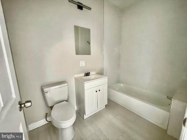 bathroom with  shower combination, vanity, toilet, and baseboards