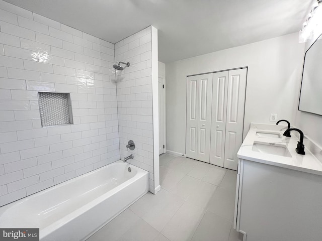 bathroom featuring shower / tub combination, a sink, baseboards, tile patterned floors, and double vanity