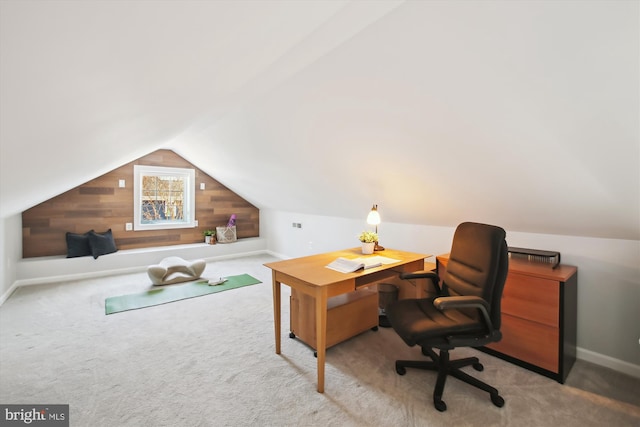 office featuring carpet floors, baseboards, and vaulted ceiling