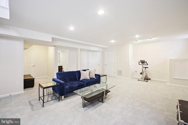 living area with light carpet, visible vents, baseboards, and recessed lighting