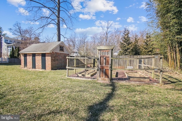 view of yard with fence and an outdoor structure