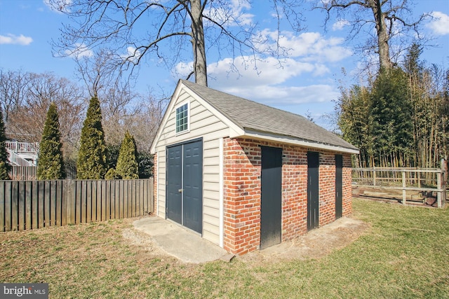 view of outbuilding with an outbuilding and a fenced backyard