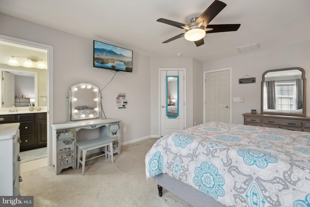 bedroom featuring baseboards, visible vents, a ceiling fan, connected bathroom, and light colored carpet