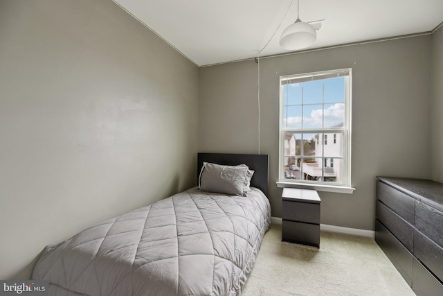 carpeted bedroom with baseboards