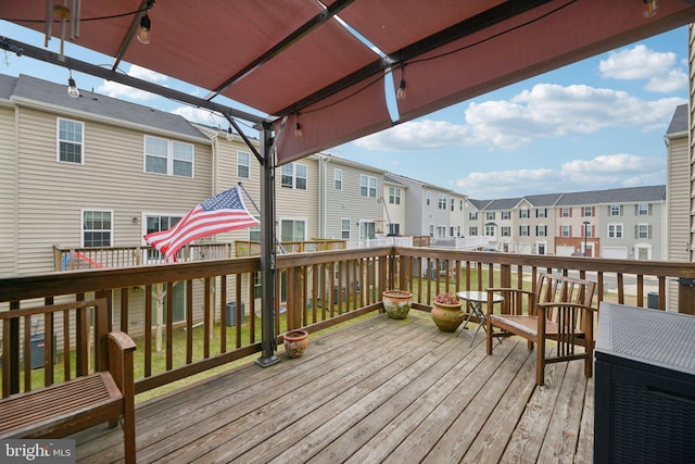 wooden deck with a residential view